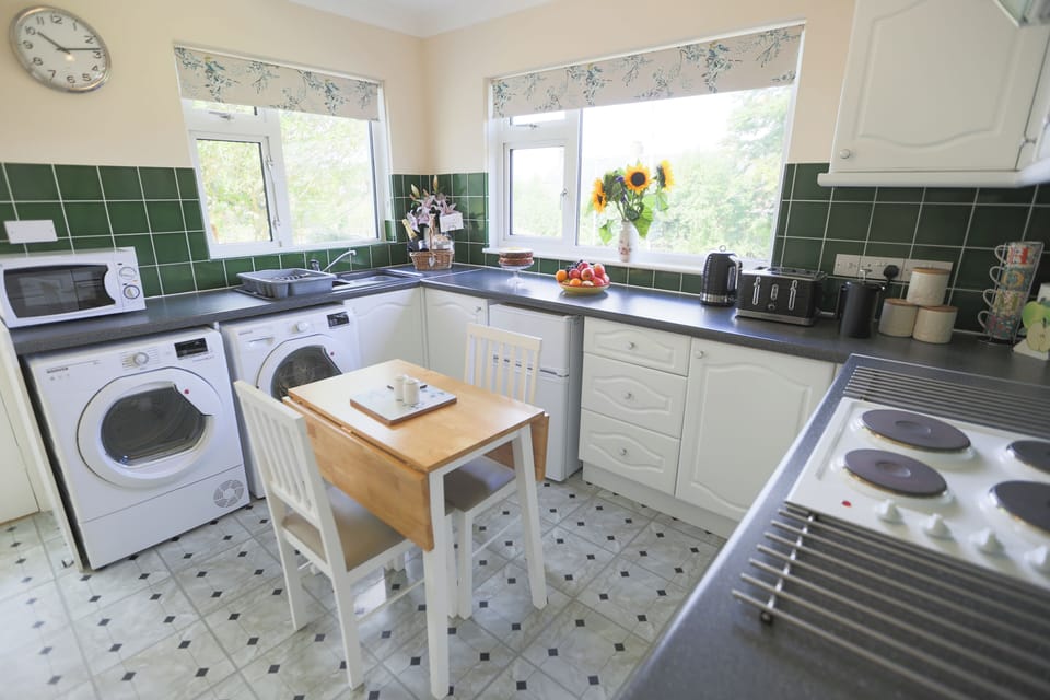 Bright, well equipped, spotlessly clean kitchen,