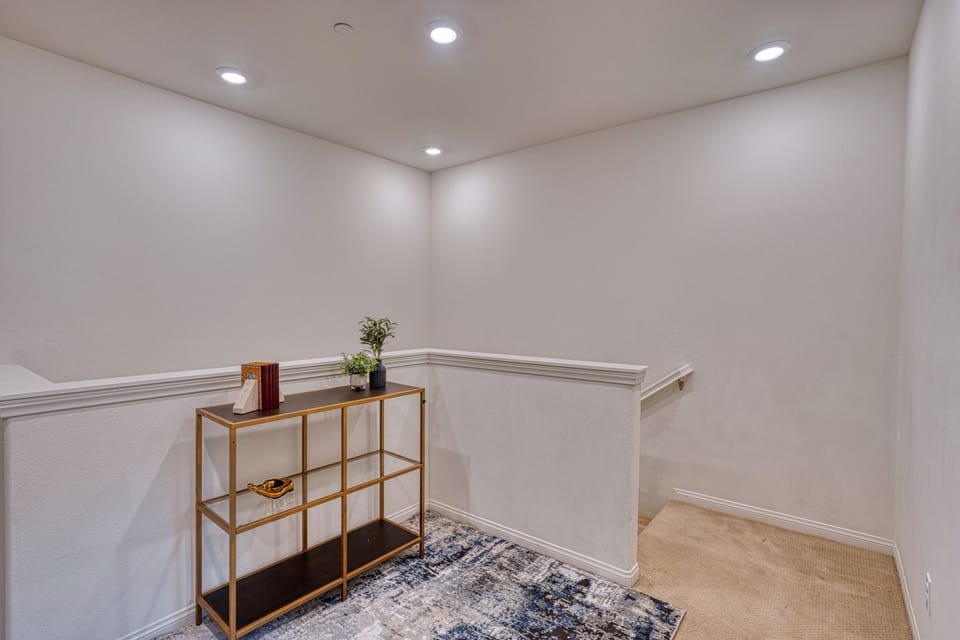 Head upstairs to find a quiet landing and access to the private bedrooms