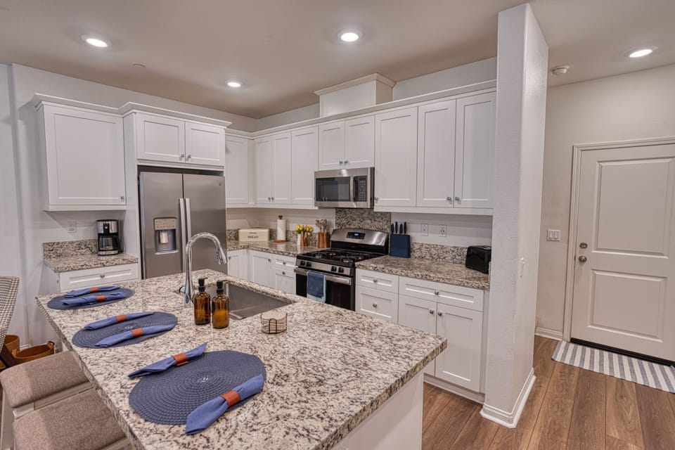 Fully equipped chef's kitchen with granite counters and stainless appliances