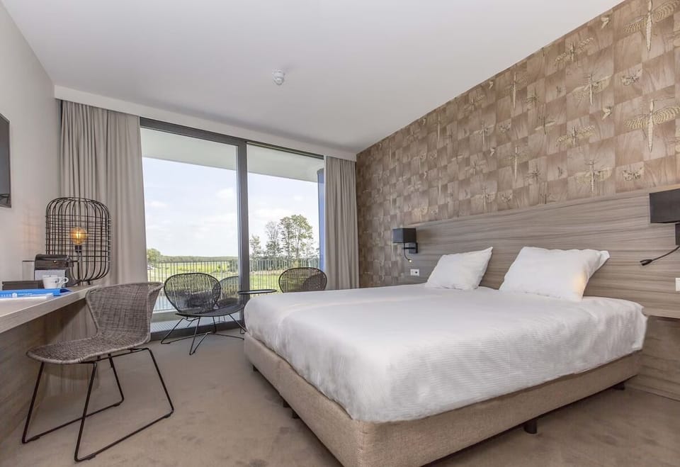 Wake up to bright lake views through expansive glass doors.