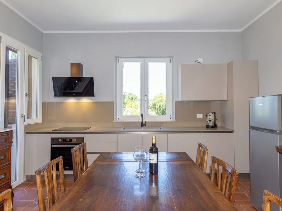 Furniture, Interior Design, Kitchen, Flooring, Cabinetry, Countertop, Kitchen Appliance, Wood, Ceiling, Floor