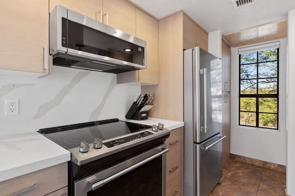 Updated kitchen with quartz counters and stainless appliances.