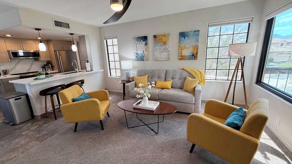 Bright, open living space with breakfast bar and modern kitchen.