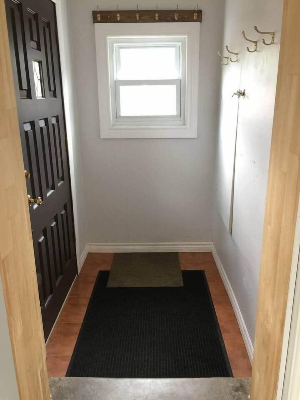 The side door entrance way, with plenty of room for shoes and coats.