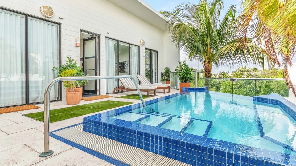 Unwind by the sparkling plunge pool with breezy tropical views.
