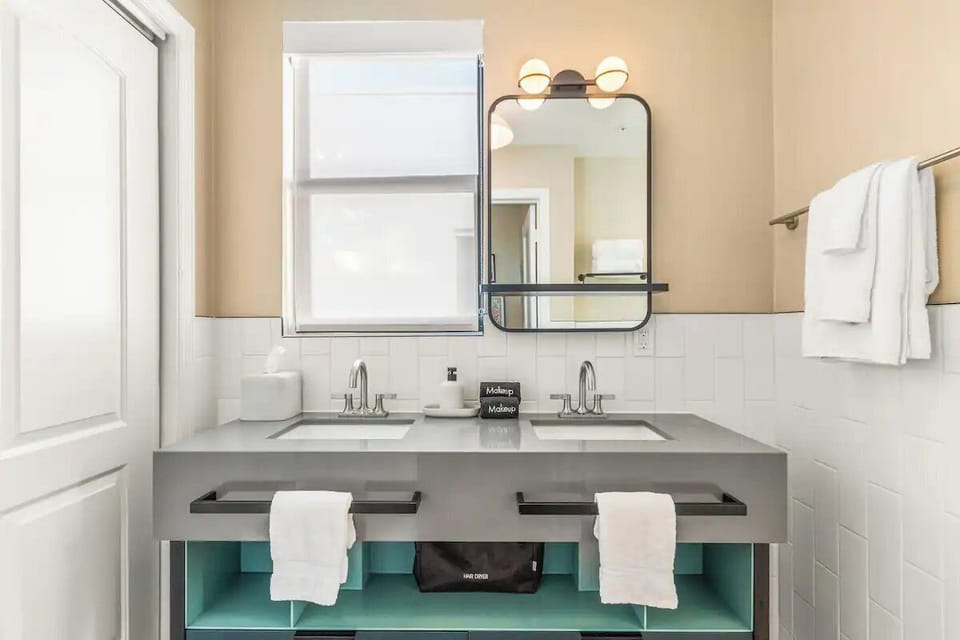 Get ready effortlessly with a bright double vanity and storage.