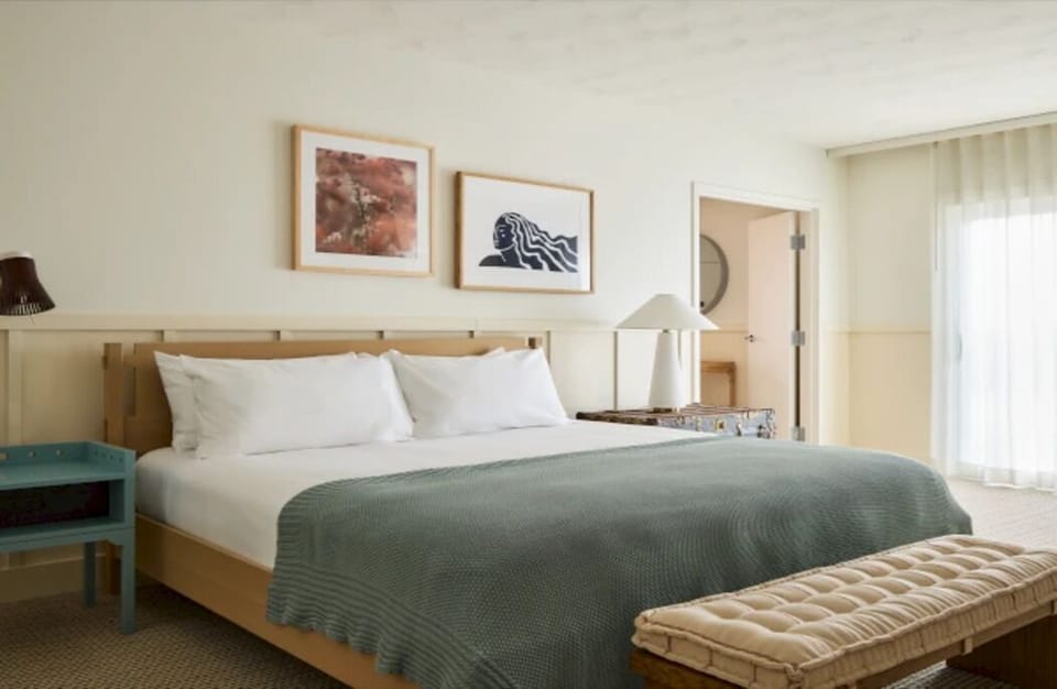 Unwind in crisp linens and a calm, sunlit bedroom.