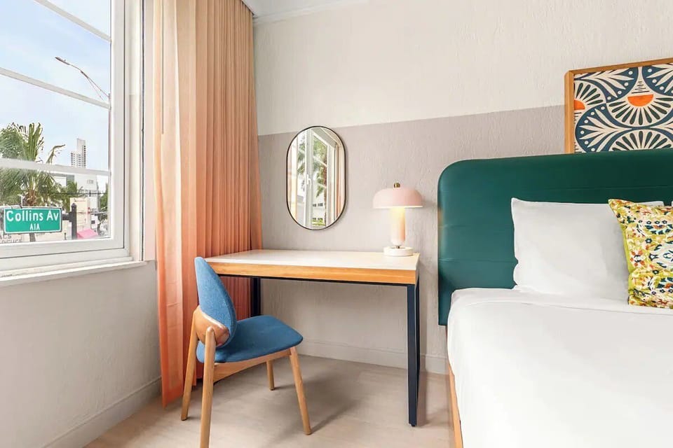 Catch up on emails at a bright desk by the window.