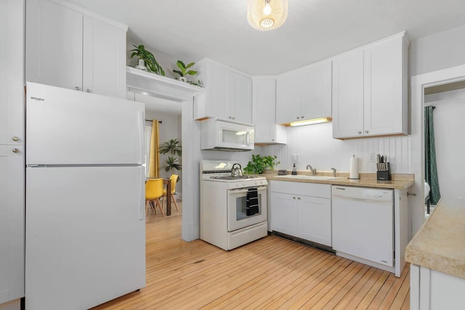 The only thing missing from this all-white kitchen is your signature dish. (No pressure!)