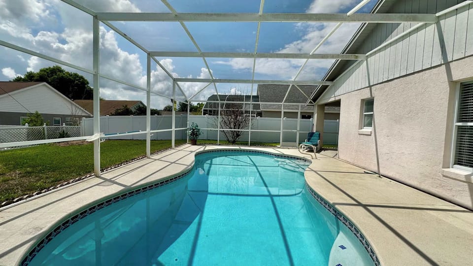 Dive into your private paradise, all screened in for your comfort