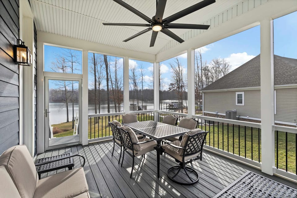 Deck - A covered area with outdoor dining table, ceiling fan, and a lake breeze that makes every meal better.