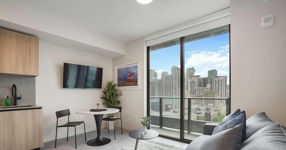 Enjoy your meals or relax in the living area, where panoramic city views are always in sight.