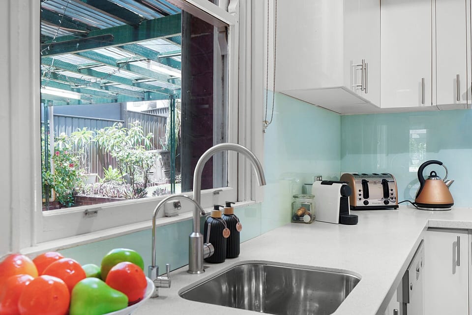 Functional kitchen with garden outlook.