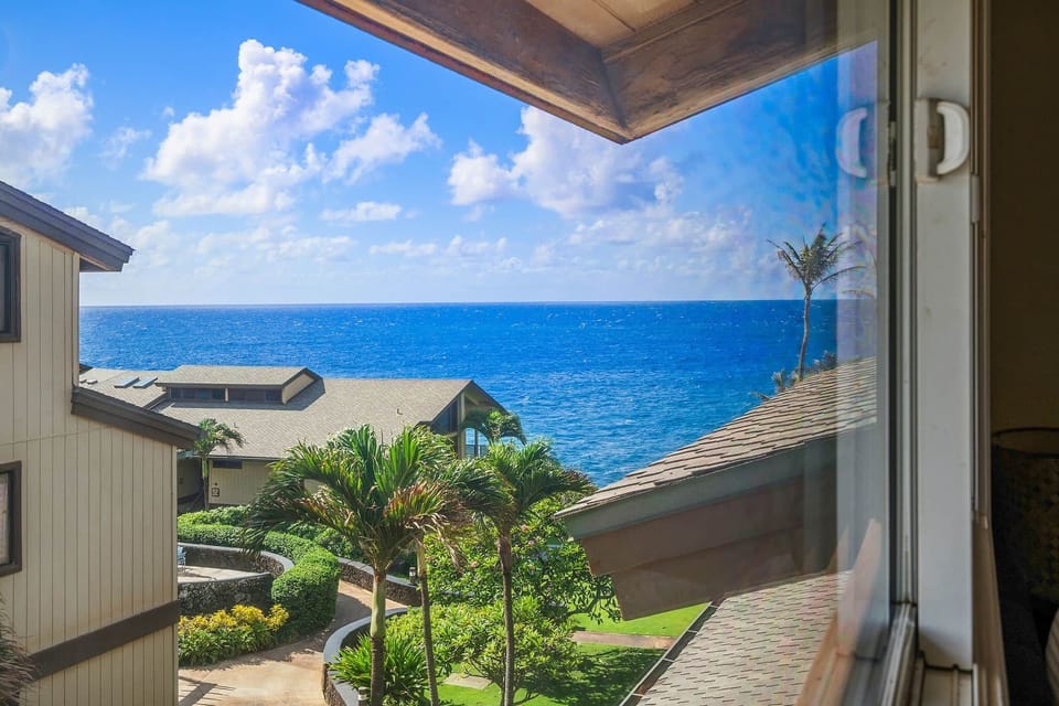 Ocean glimpse from the window with views across the surrounding resort grounds