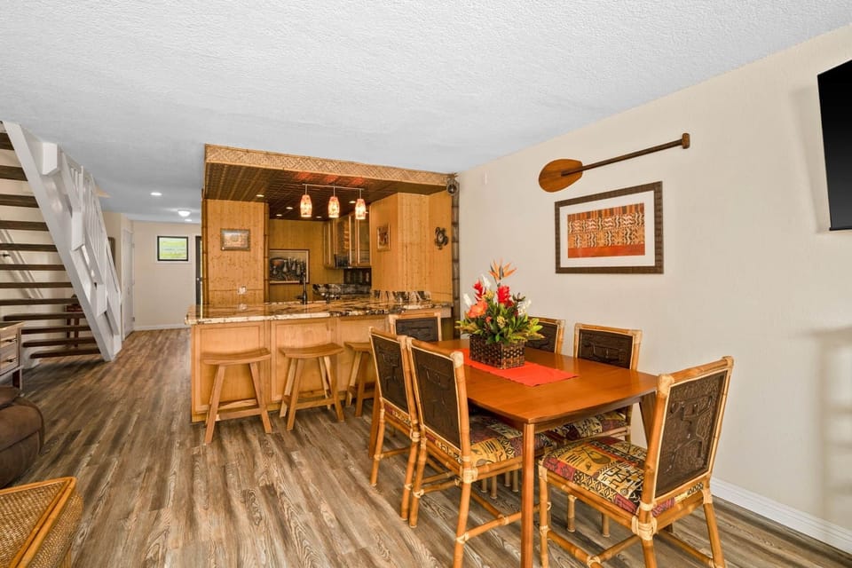 Dining area with bamboo accents, natural textures, and a bright, open island feel