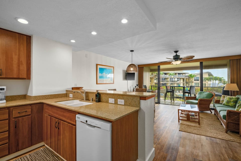 Open kitchen flows to lanai—cook, dine, and soak in ocean views
