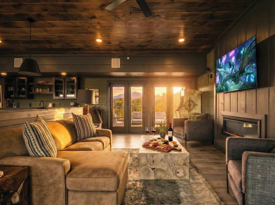 Cozy  lounge w/ big screen TV, fireplace & comfy seating for movie nights