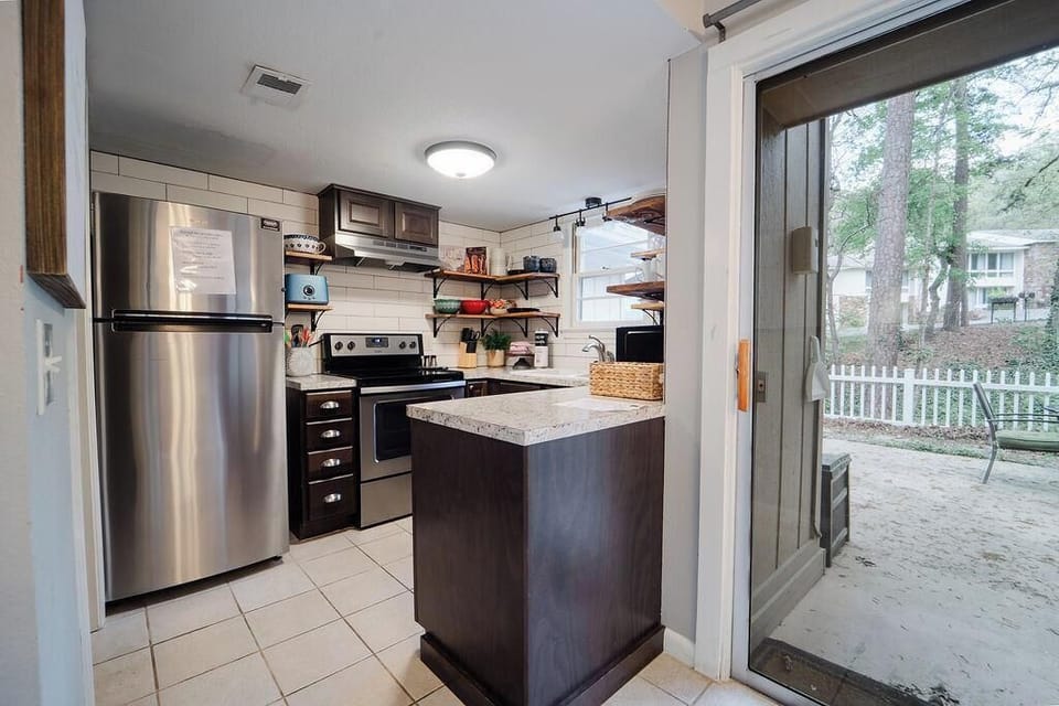 Kitchen with updated appliances and fully stocked for cooking 