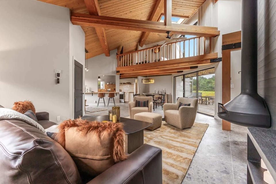 Cozy living area with ocean views and a fireplace.