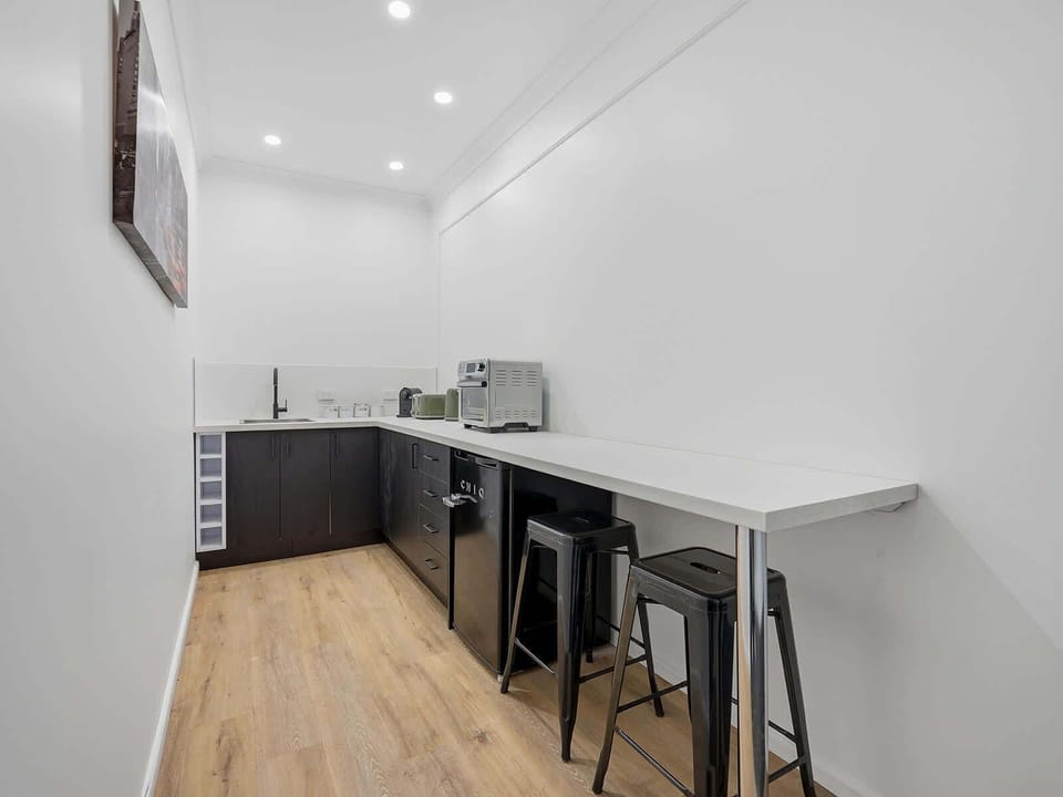 Kitchen + Coffee Machine + Breakfast Bar with Stools