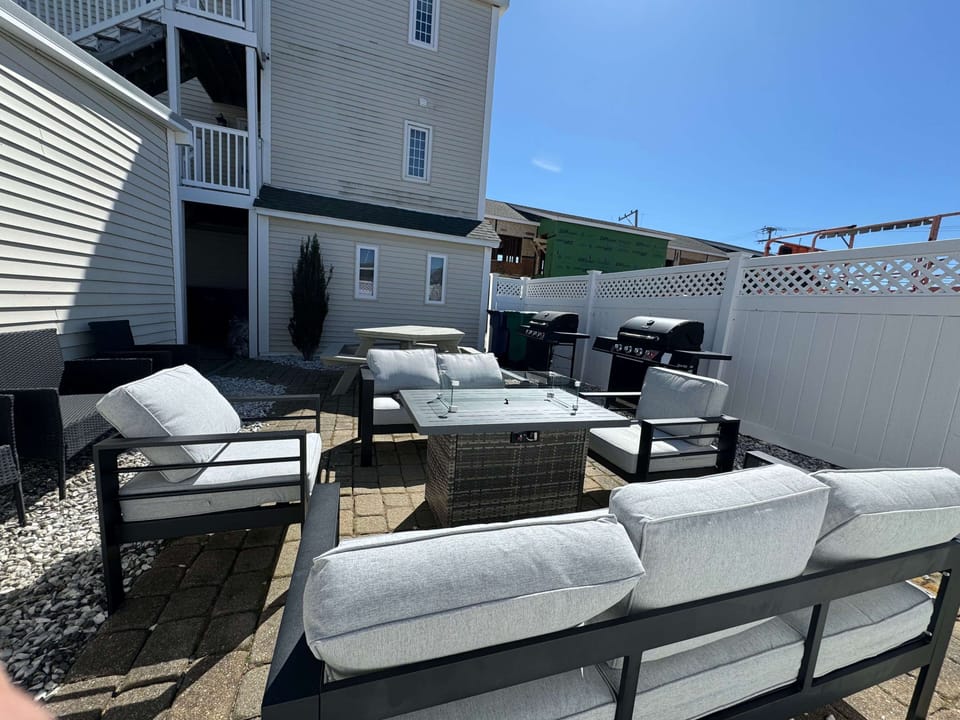 Shared patio area has a propane fireplace.