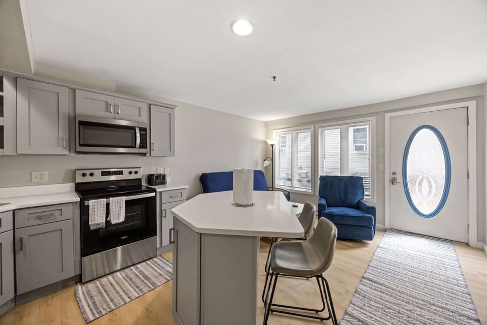 Full kitchen with island provides plenty of space for cooking and eating.