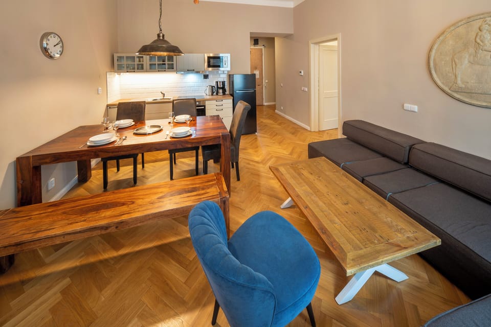 Living room with folding double sofa bed and large dining table