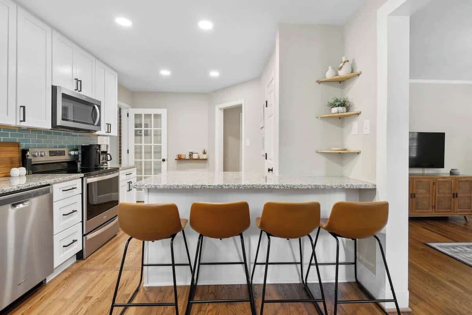 Enjoy casual meals or morning coffee at the kitchen counter with comfortable bar seating — perfect for quick bites or planning your day.