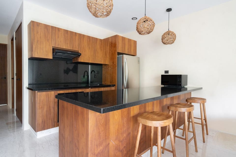Modern kitchen with bar & warm wood design ✨