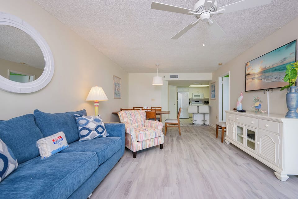 Relax in the vibrant living area, enjoying cozy conversations while you watch a favorite show or movie