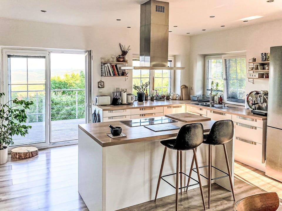 Furniture, Kitchen, Countertop, Interior Design, Kitchen Appliance, Flooring, Cabinetry, Floor, Chair, Wood