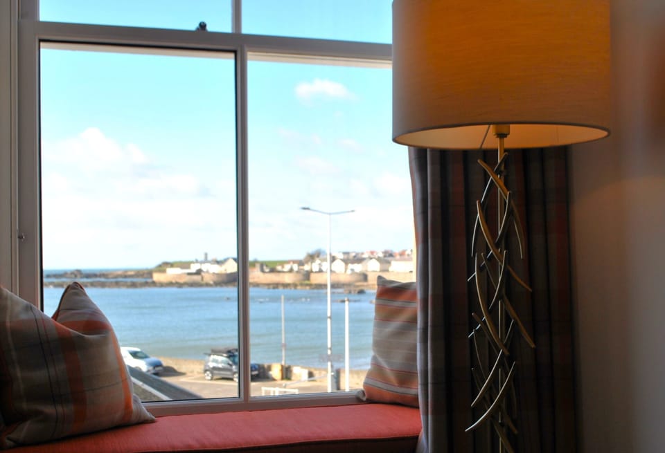 The lounge looks out over the harbour walls