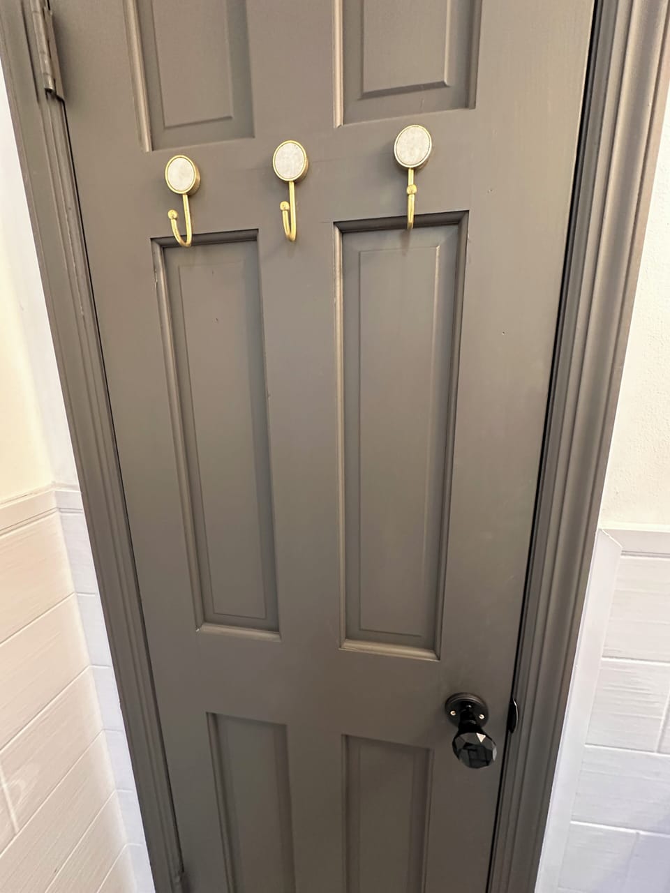 Modern hooks on bathroom door