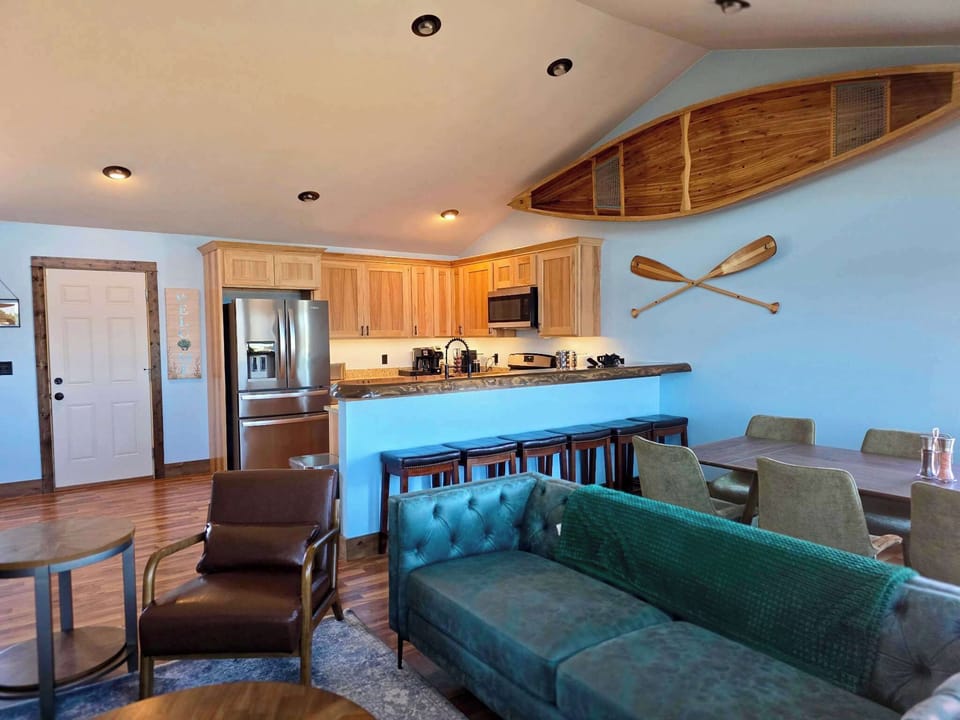 Relax in our spacious upstairs living room, featuring an open-concept design that connects perfectly to the kitchen and dining area for seamless family gatherings.