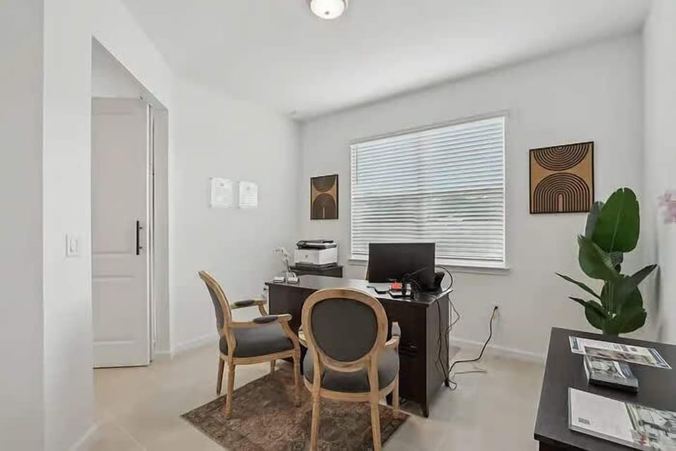 Cozy office space perfect for remote work with natural light and elegant decor.