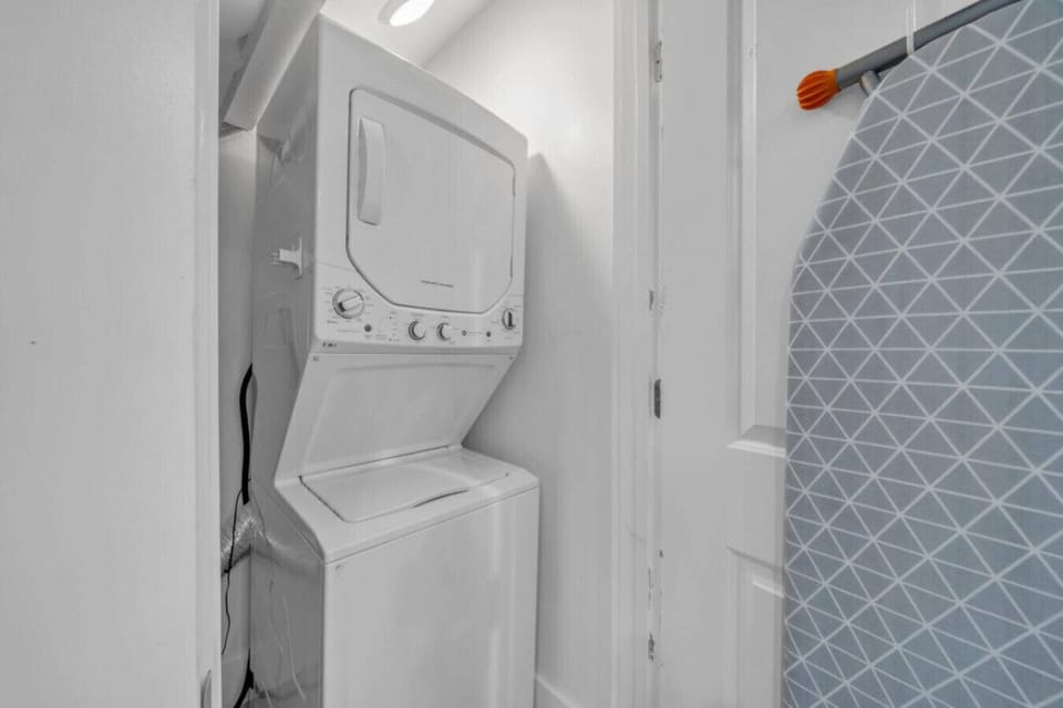 Floor 1: Laundry room with washer/dryer & ironing board