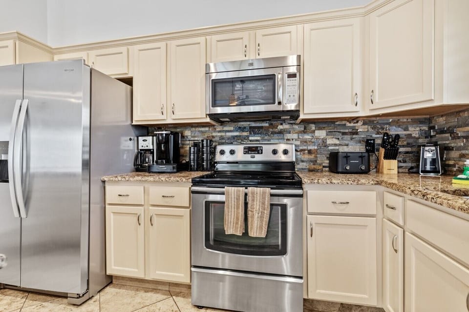 ☕ Everything you need for your morning routine, including a coffee maker, microwave, and plenty of cabinet storage.