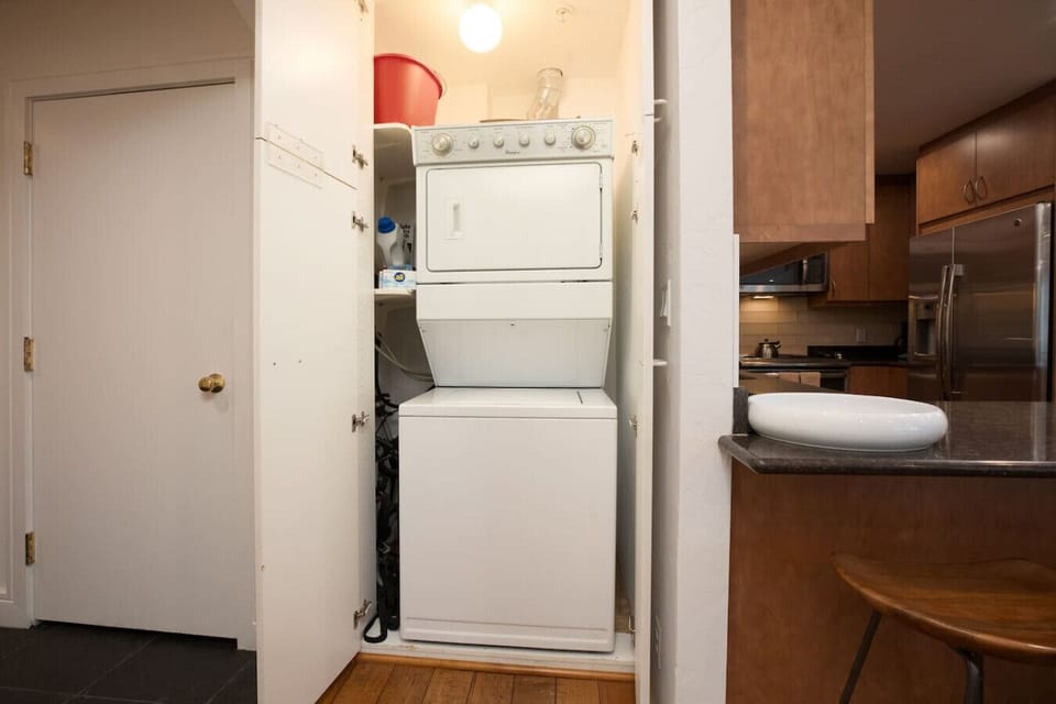 Washer and Dryer in Unit Stocked with Detergent