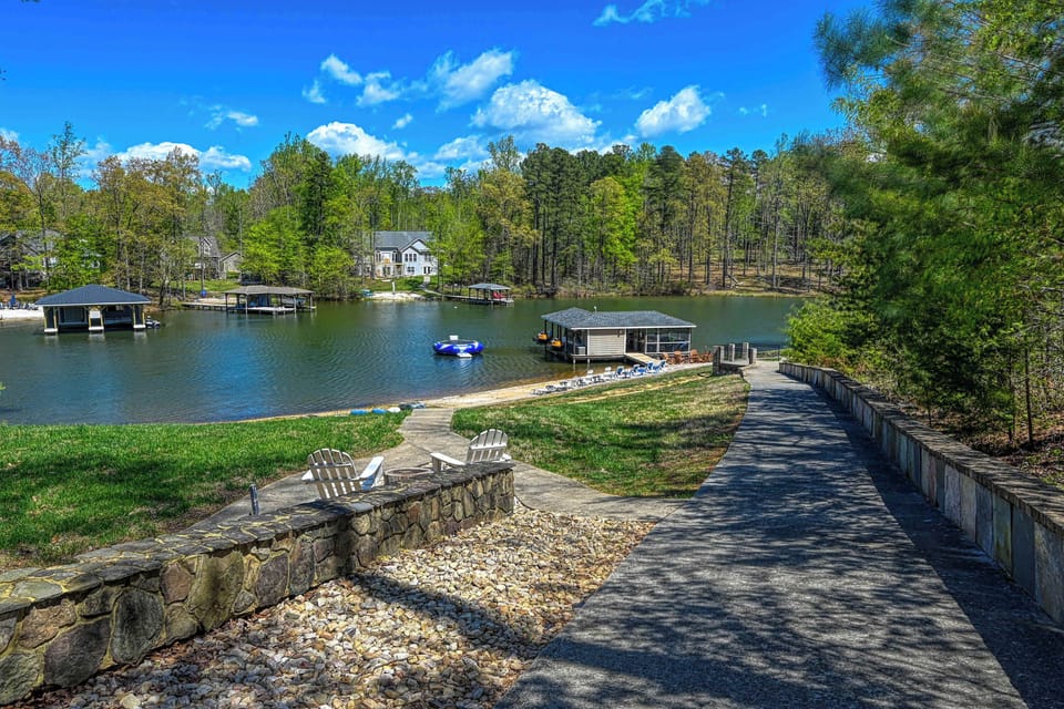 Lakefront - Stone retaining wall and dock seen from above the bank, the path down to the water.