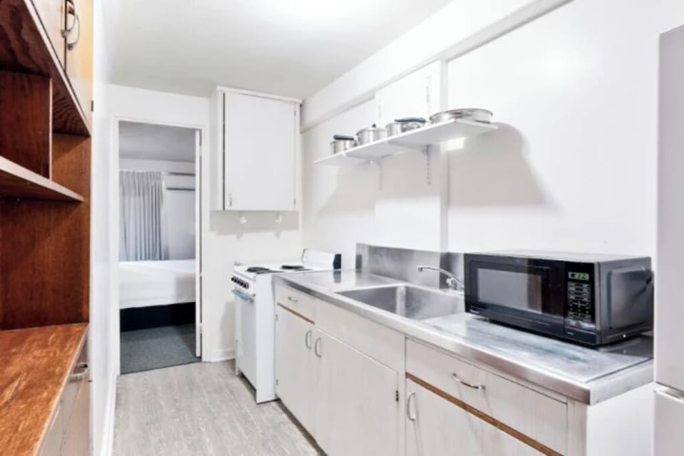 Cook simple meals easily with sink, stove, and microwave.