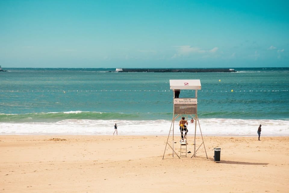 Saint-Jean-de-Luz's famous sheltered bay beach, one of the finest on the Basque coast, basks under a brilliant summer sky.