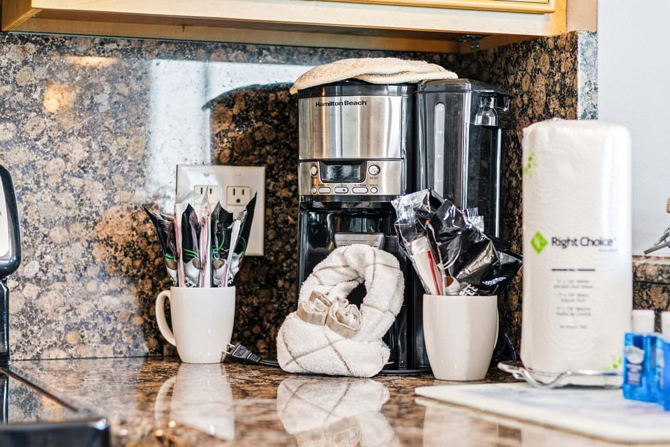 A drip coffee maker is ready on the counter for a slow start to the morning.
