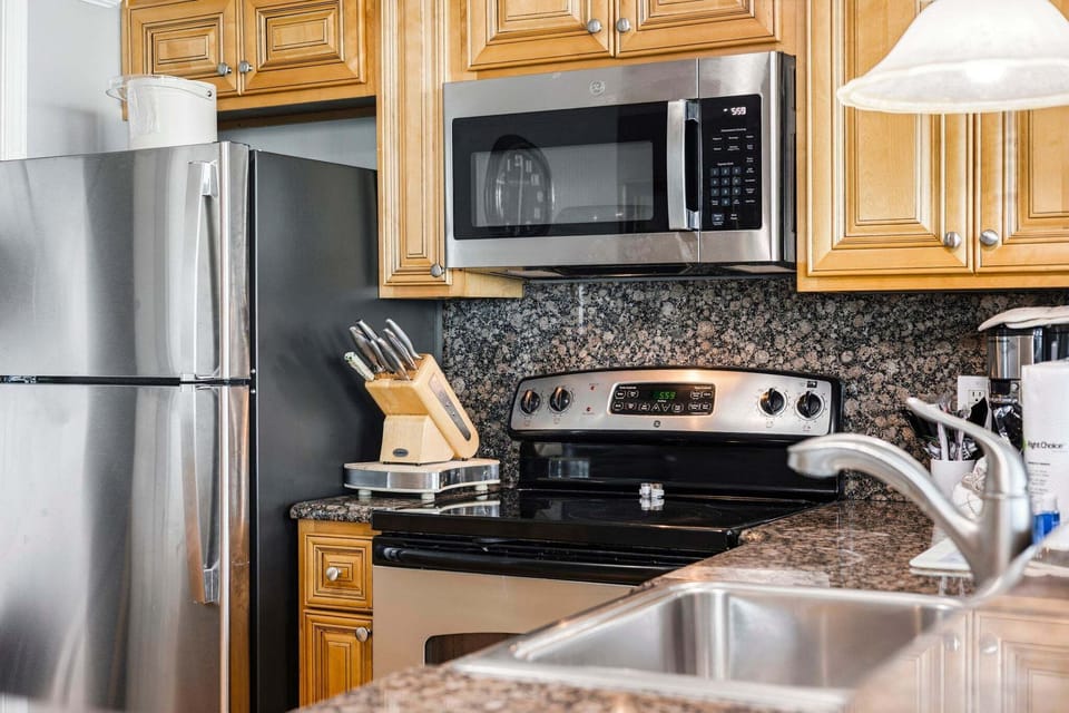 Modern appliances and ample counter space make it easy to prepare meals at home.