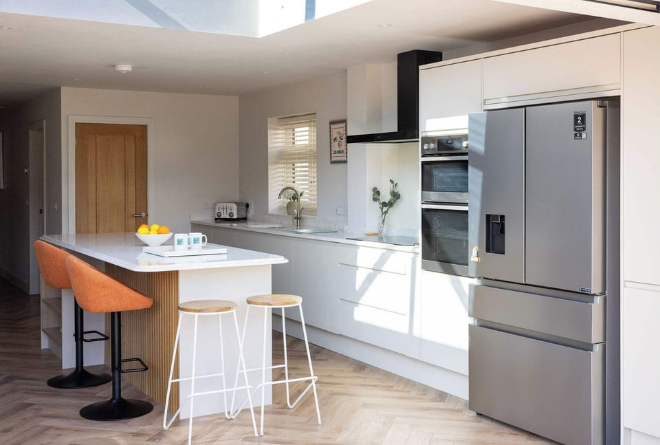 Contemporary coastal home with a fully equipped kitchen and spacious layout for relaxed family living.