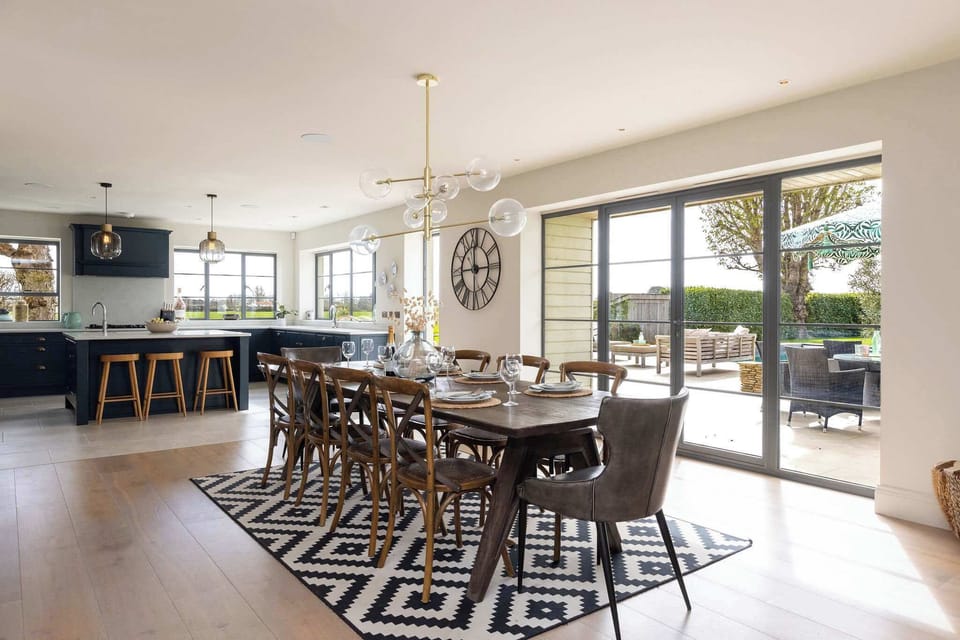 Open-plan dining flowing into the kitchen with direct garden access for relaxed entertaining.