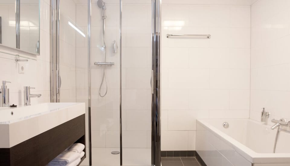 Refresh with a rainfall shower and a relaxing deep bath.