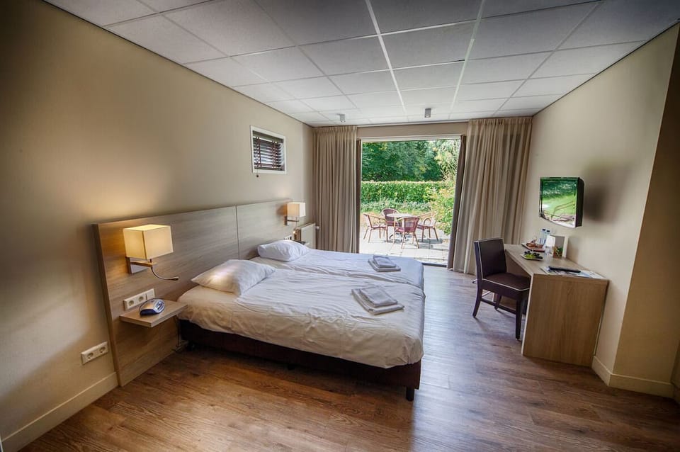 Wake up to garden views and step straight onto the terrace.