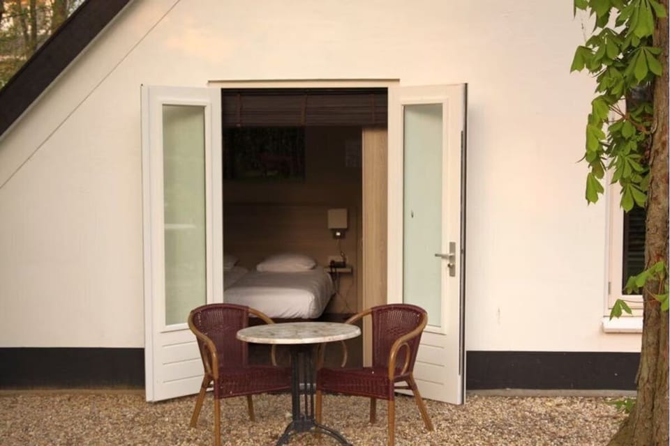 Sip morning coffee outside your room in peaceful surroundings.
