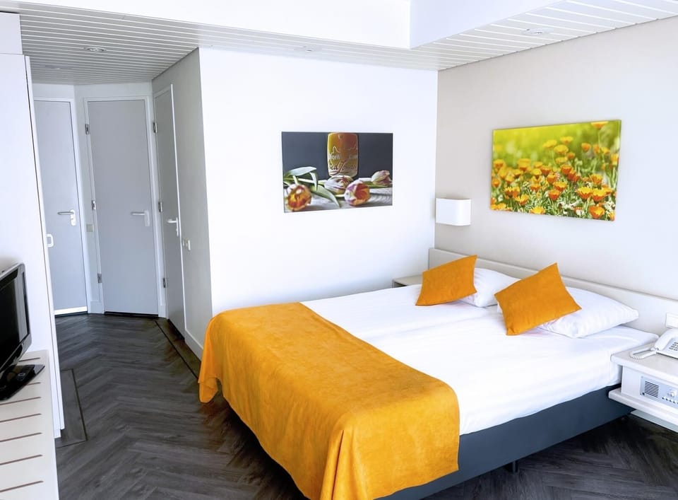 Sink into crisp linens and enjoy an uncluttered, modern room.