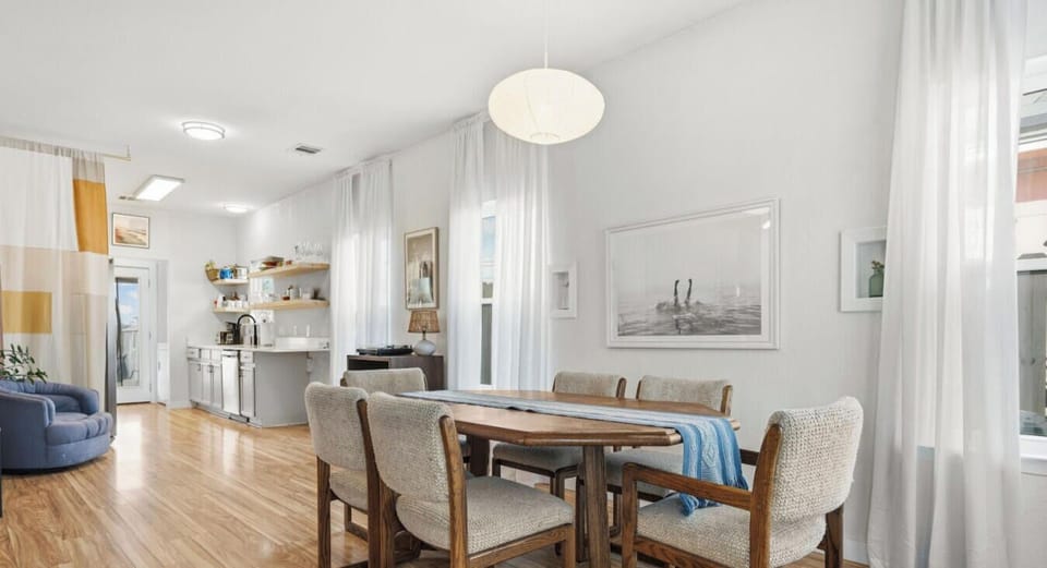 The dining area opens directly to the kitchen, making meal prep and group dinners a breeze.